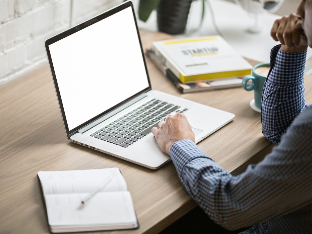 young man busy working on laptop during workout - Millennial searching or  waiting for online yoga class on mat - Concpet of new normal, work from home  Stock Photo - Alamy